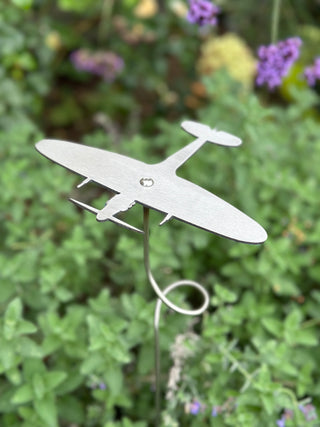 Stainless steel Spitfire garden ornament stake on 90cm spiral stem, angled view showing flying effect