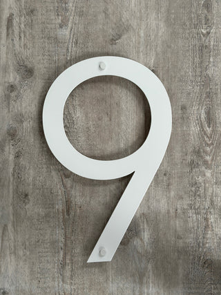 Extra large house number made from stainless steel and powder-coated on matt white paint. 