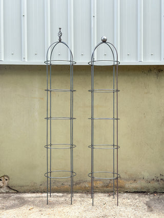 Extra strong and tall metal garden obelisks  with a round top and decorative finial. 